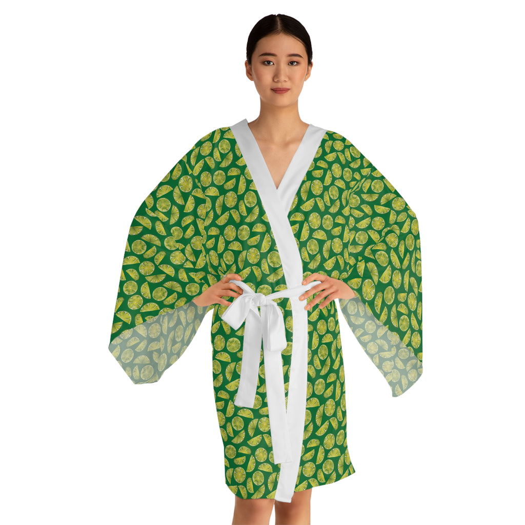 Woman wearing a green and white patterned robe on a white background