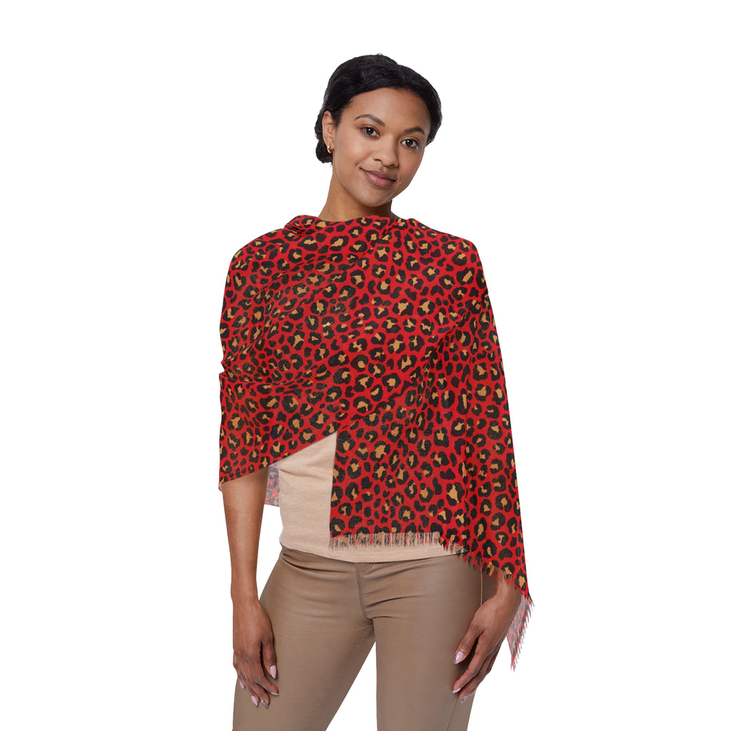 Woman wearing a red leopard print top on a white background