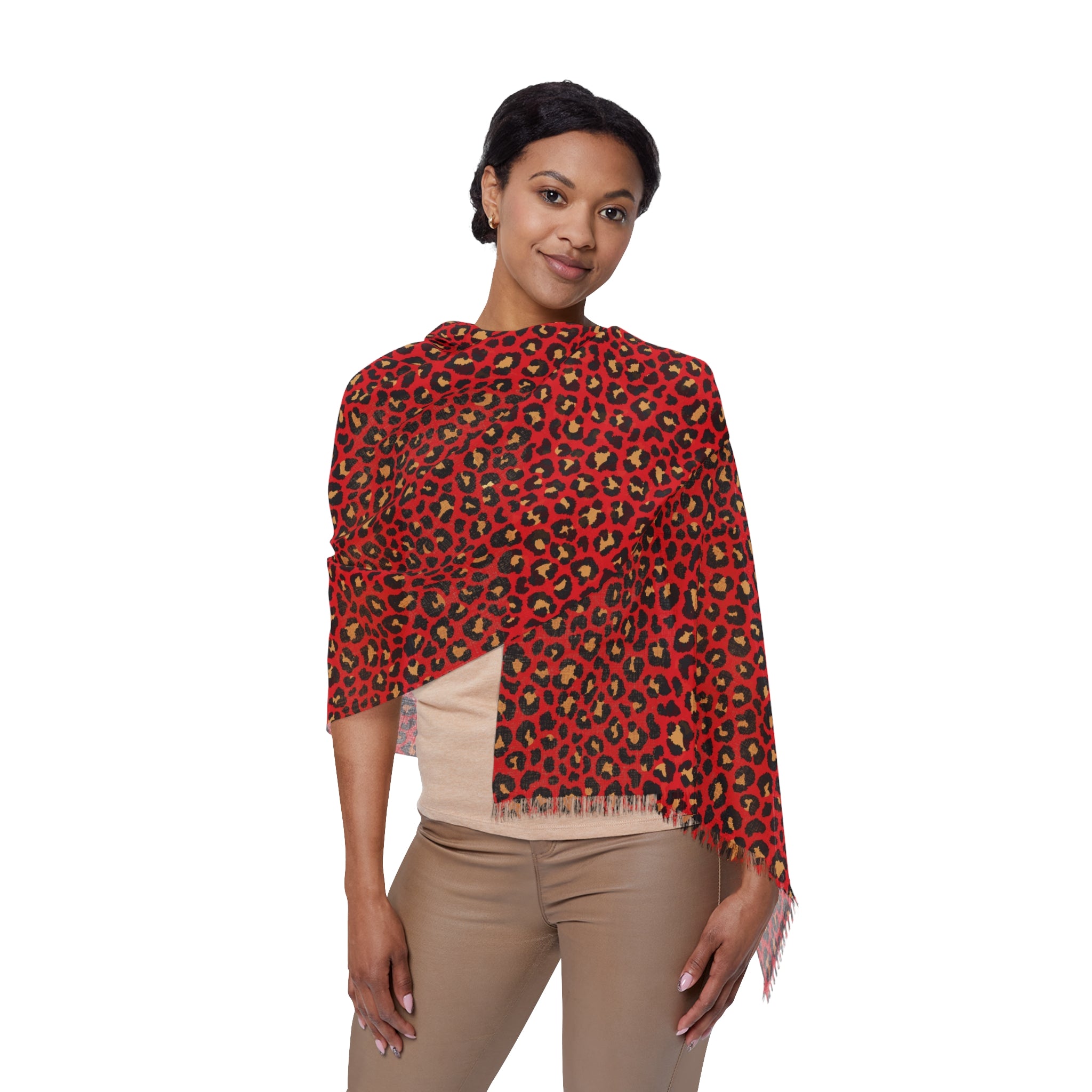 Woman wearing a red leopard print top on a white background