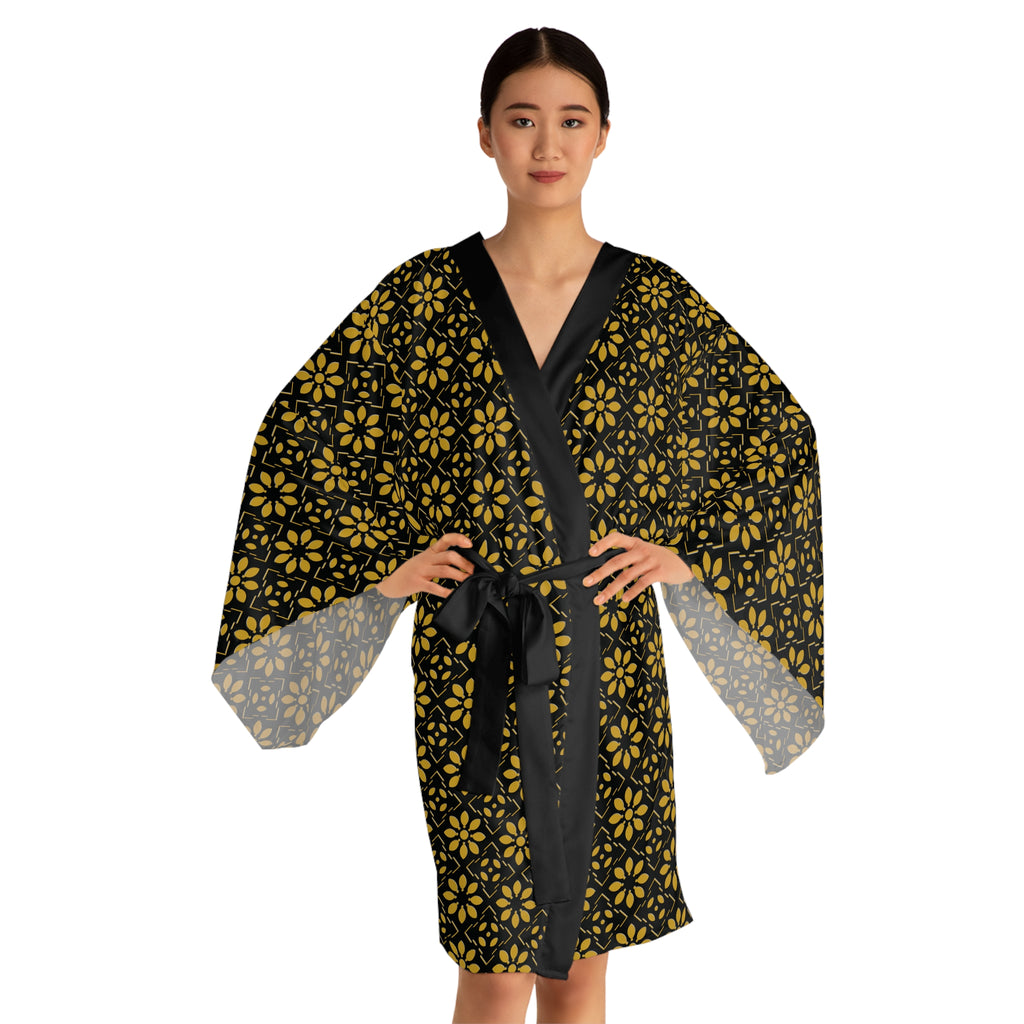 Woman wearing a black and yellow patterned robe on a white background