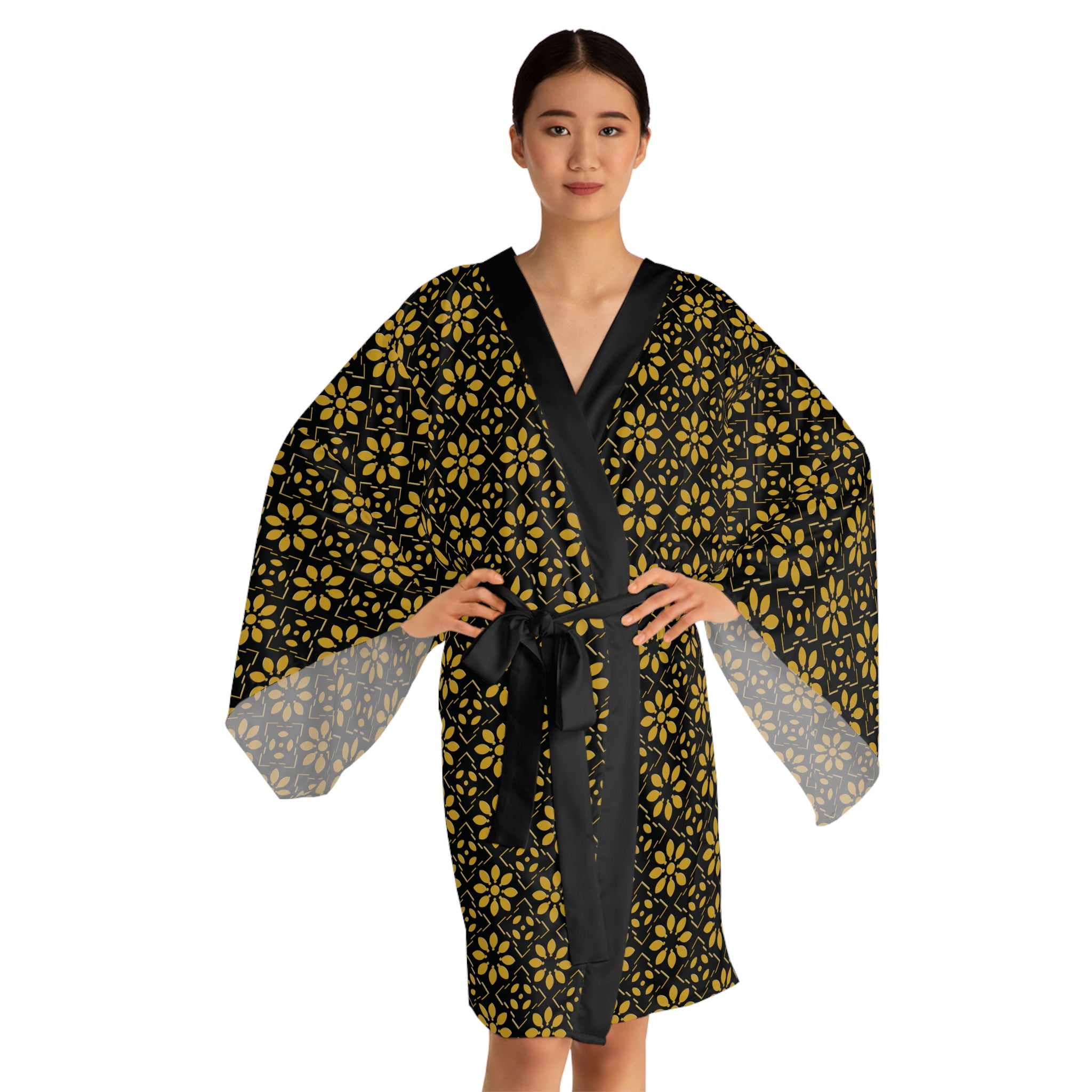 Woman wearing a black and yellow patterned robe on a white background
