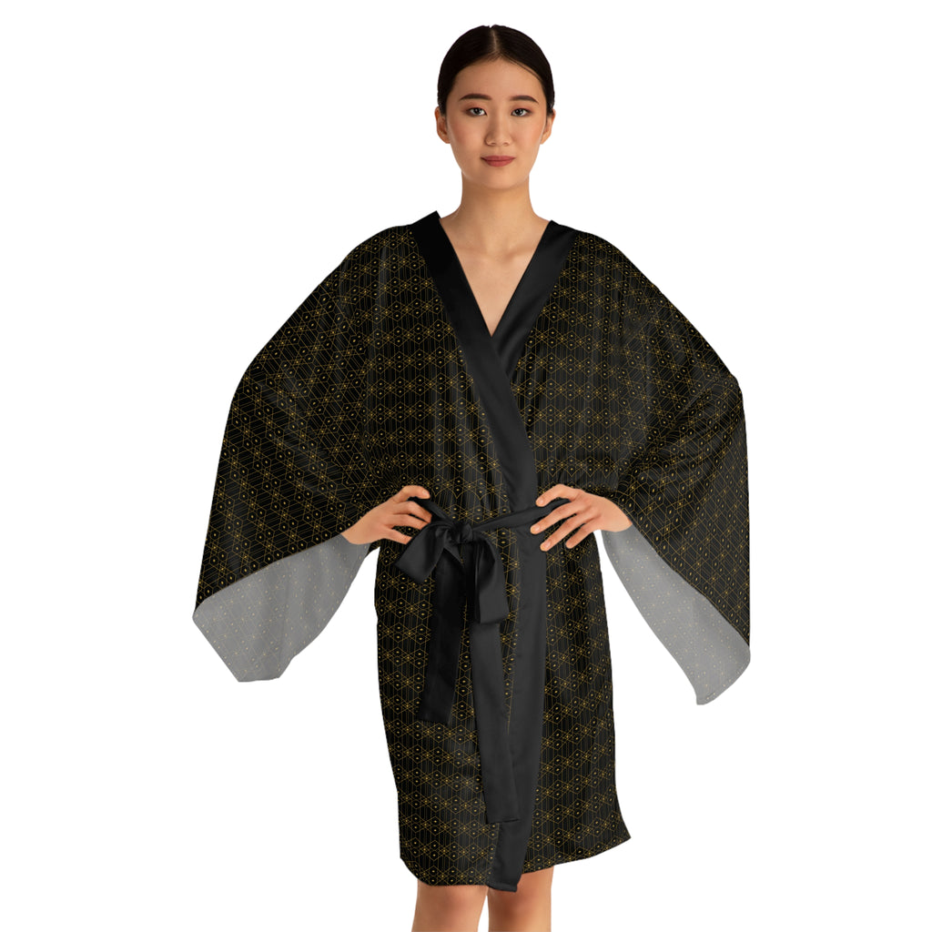 Woman wearing a black patterned robe on a white background