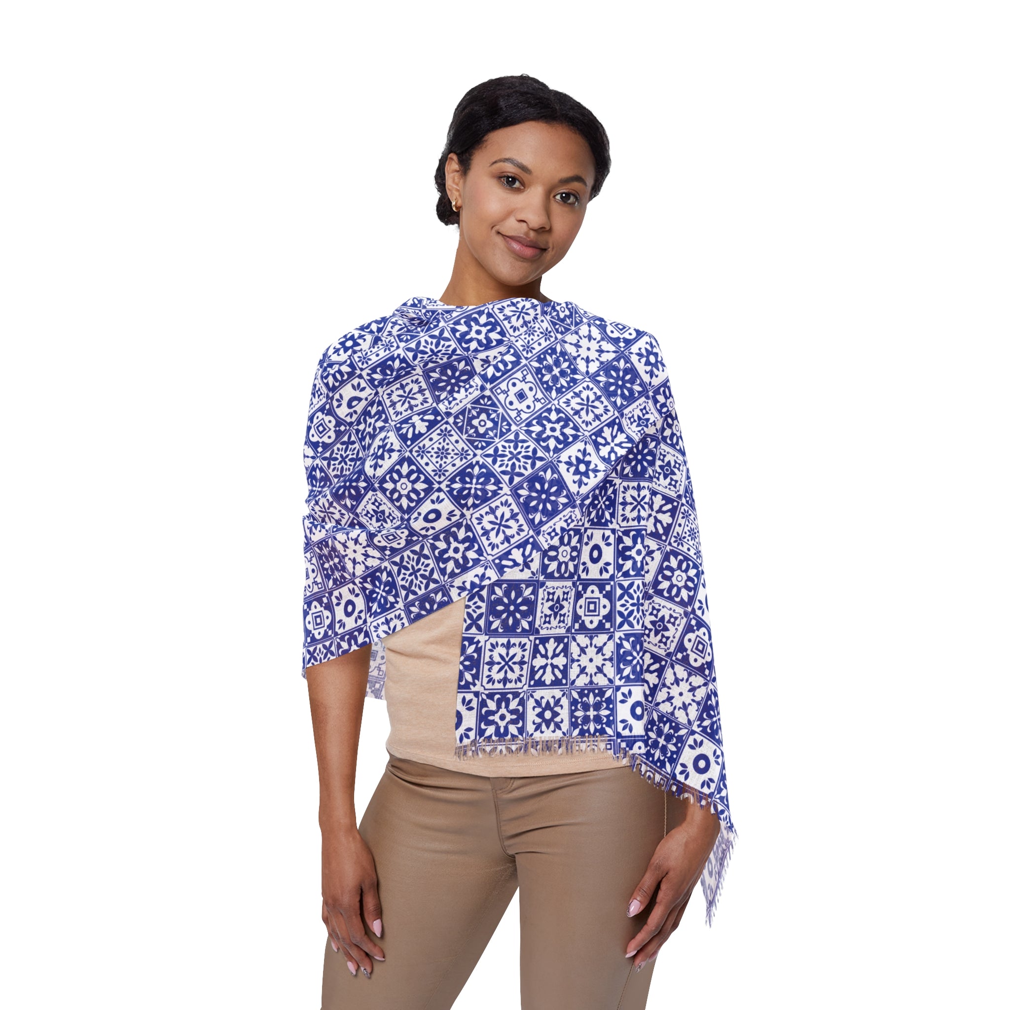 Woman wearing a blue and white patterned top on a white background