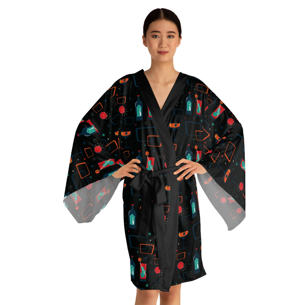 Woman wearing a black robe with colorful geometric pattern on a white background