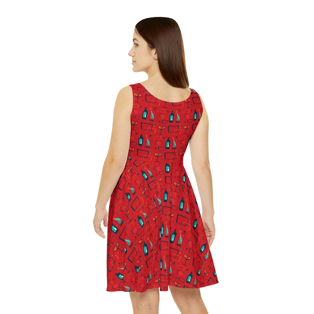 Woman wearing a red dress with blue patterns on a white background