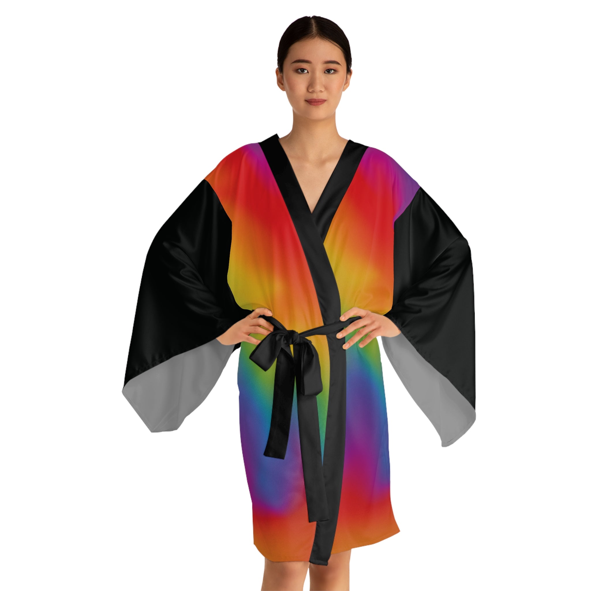 Woman wearing a colorful robe with black trim on a white background